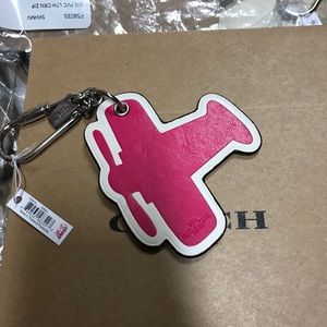Coach airplane keychain